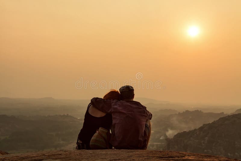 HAMPI, KARNATAKA, INDIA - JANUARY 15 2017: A couple is watching royalty free stock photos HAMPI, KARNATAKA, INDIA - JANUARY 15 2017: A couple is watching royalty free stock photos