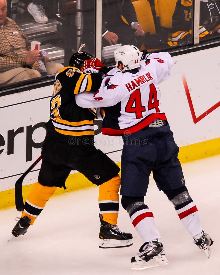 Washington Capitals defenseman Roman Hamrlik and Boston Bruins forward Brad Marchand battle during game 2 of their 2012 Playoff series. Washington Capitals defenseman Roman Hamrlik and Boston Bruins forward Brad Marchand battle during game 2 of their 2012 Playoff series.