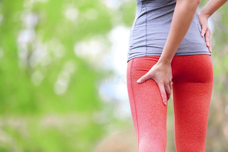 Hamstring sprain or cramps. Running sports injury with female runner. Closeup of woman back thigh. Hamstring sprain or cramps. Running sports injury with female runner. Closeup of woman back thigh.