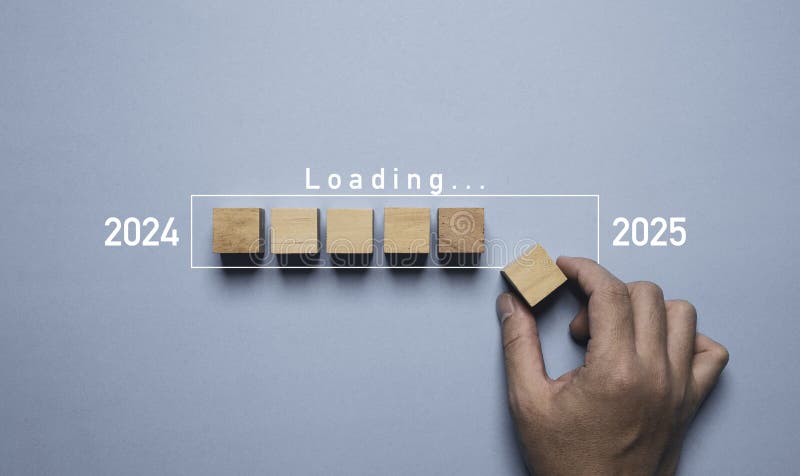 Hand assemble wooden block cube to update technology downloading tool bar status from 2024 to 2025 , Merry Christmas and happy new stock photography