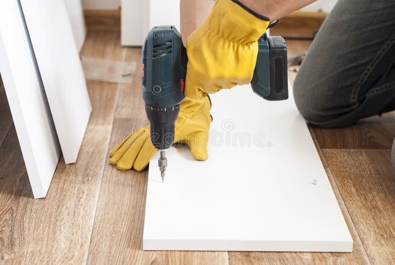 Hand assembly of furniture stock photo. Image of building 92027322