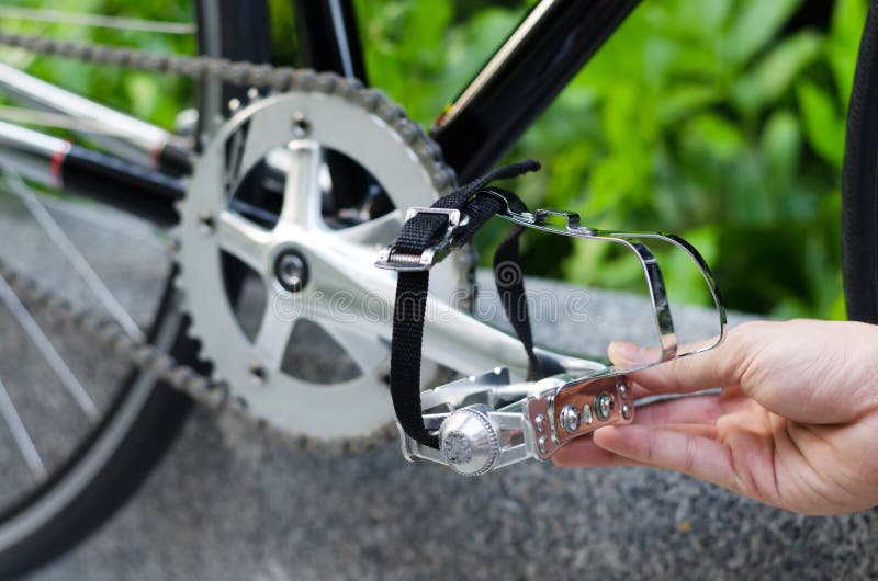 Hand with bicycle pedal stock image. Image of hand, chain 68864431