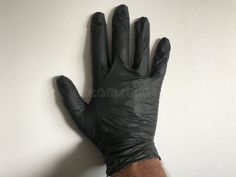Hand in black glove stock photo. Image of black, protective 193473422