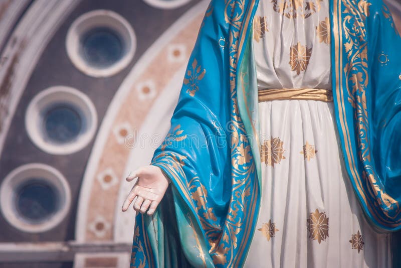 The Blessed Virgin Mary statue standing in front of The Cathedral of the Immaculate Conception at The Roman Catholic Diocese.