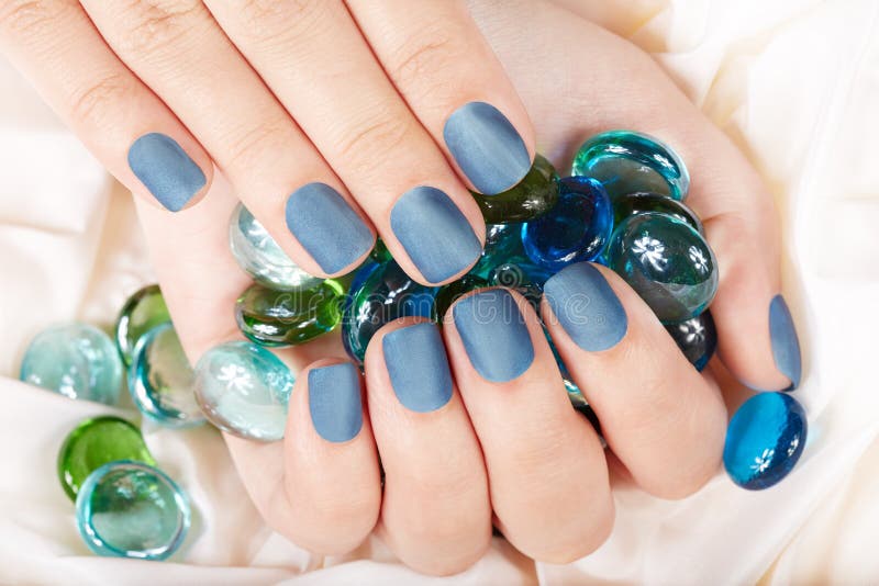 Nails with blue matte manicure. Cat spa stock images, royalty-free photos and pictures