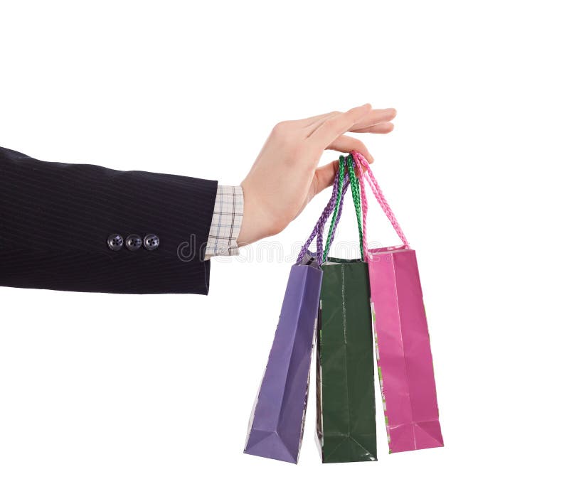 Hand of Business Style dressed Man holding small shopping Bags