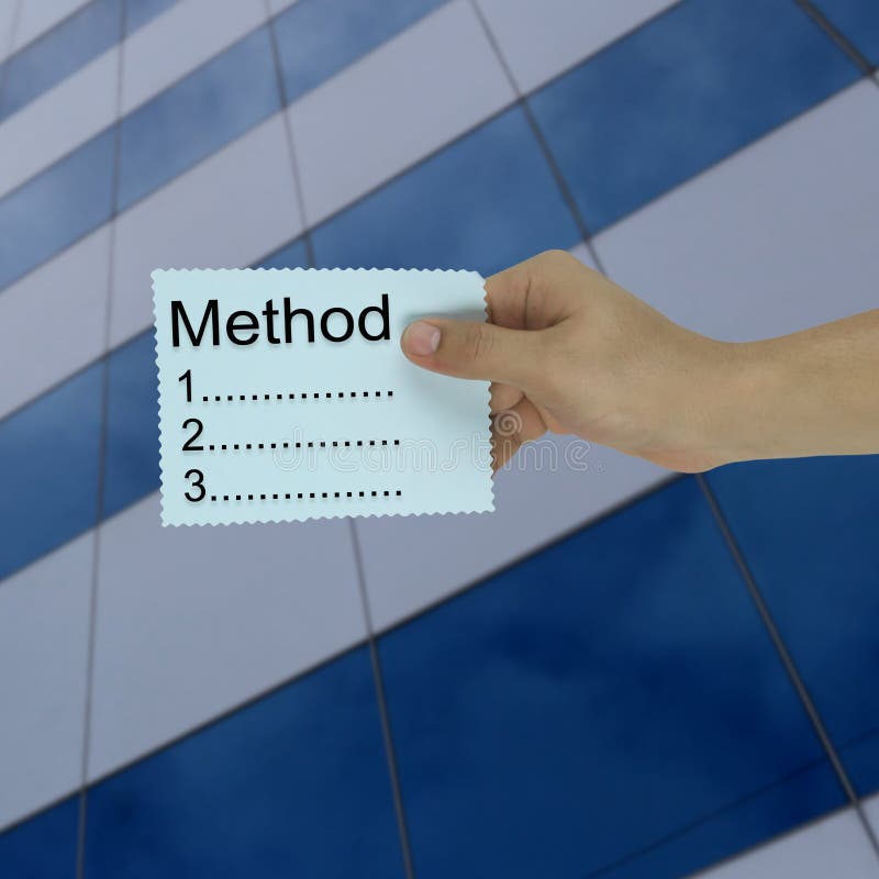 Hand of the businessman holding a paper note with method text on royalty free stock image