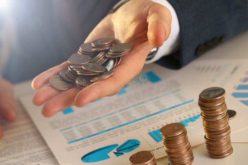 Hand businessman putting pin money into pig royalty free stock photo Hand businessman putting pin money into pig royalty free stock photo