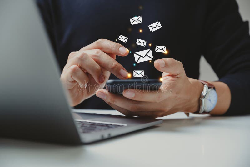 Hand of businessman using smartphone with e-mail icon