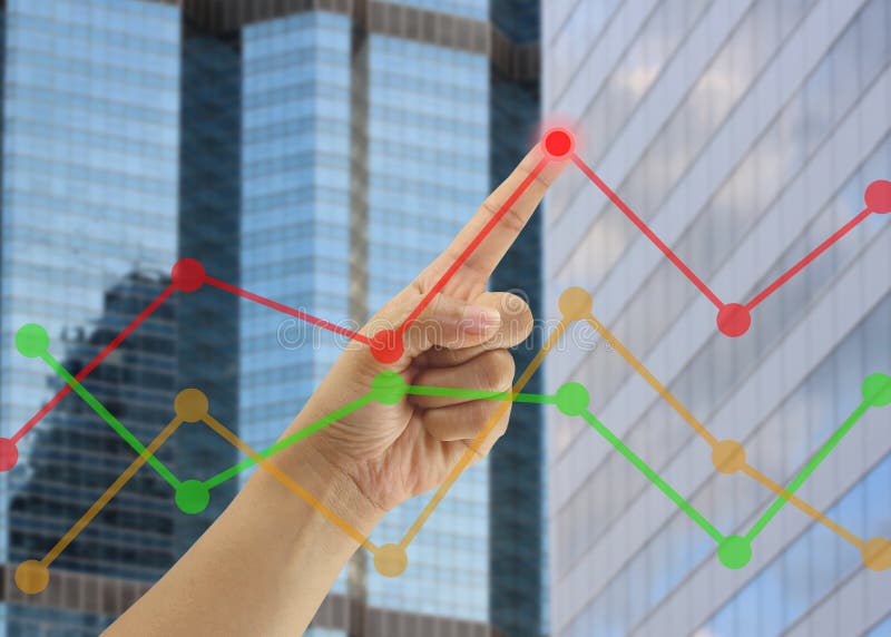 Hand of businessmen point to the highest point on the line graph in concept of business profits in the presentation.