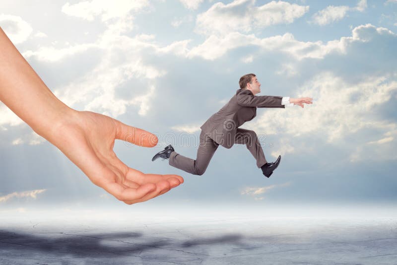 Hand catching businessman running forward royalty free stock photos