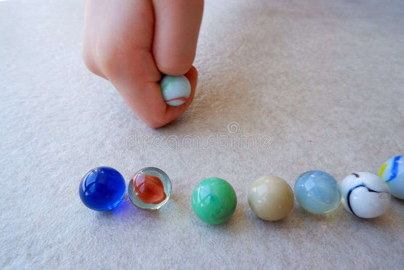 Row of colorful marbles stock photo. Image of abstract 7379612