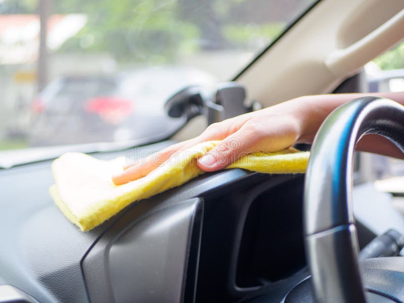 Hand Cleaning Interior Car Steering Wheel with Microfiber Cloth Stock