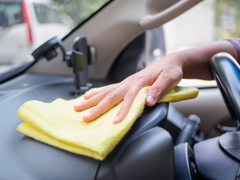 Hand Cleaning Interior Car Steering Wheel with Microfiber Cloth Stock