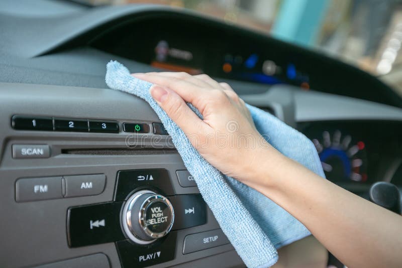 Hand Cleaning Interior Modern Car with Microfiber and Cleaning Console