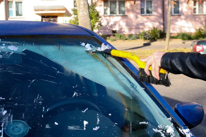 Hand Scratching Ice From Car Window Stock Photo - Download Image