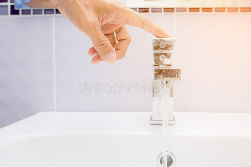 Hand close water tap stock images