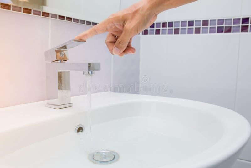 Hand close water tap stock photography
