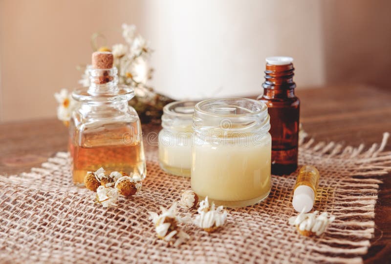 Hand cream and lip balm in a glass jar. Natural organic cosmetics with honey, wax and oils