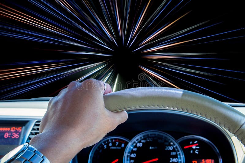 Hand of driver holding steering wheel, with abstract speed motion light lines background. Hand of driver holding steering wheel, with abstract speed motion light lines background