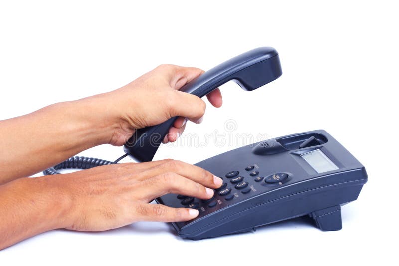 Hand dialing or picking up telephone. stock image
