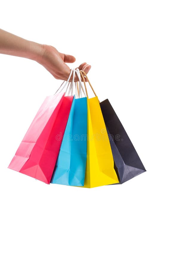Hand, die bunte Papiereinkaufstaschen hält lizenzfreie stockfotografie Hand, die bunte Papiereinkaufstaschen hält lizenzfreie stockfotografie
