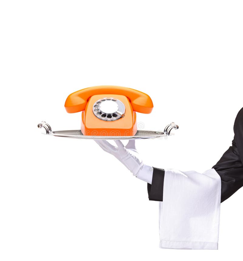 Hand die een dienblad met een oranje telefoon houdt stock afbeelding Hand die een dienblad met een oranje telefoon houdt stock afbeelding