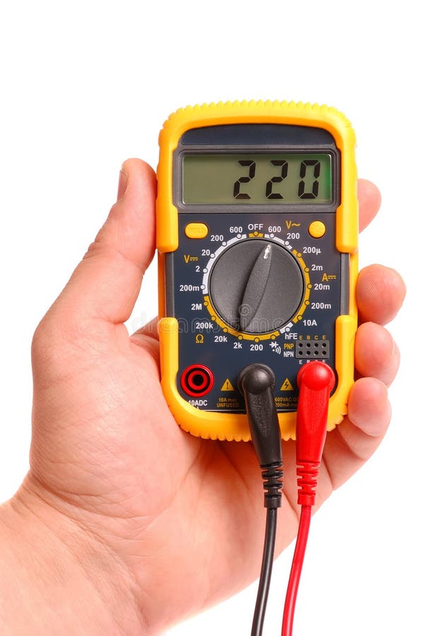 Hand with a digital multimeter on a white