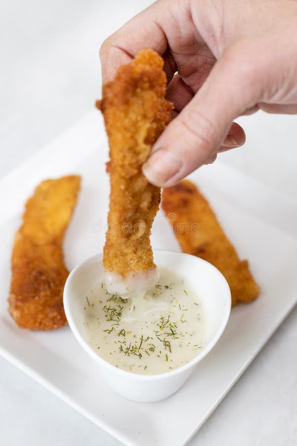 Hand Dip Fried Chicken in Dill Sauce Above White Marble Table