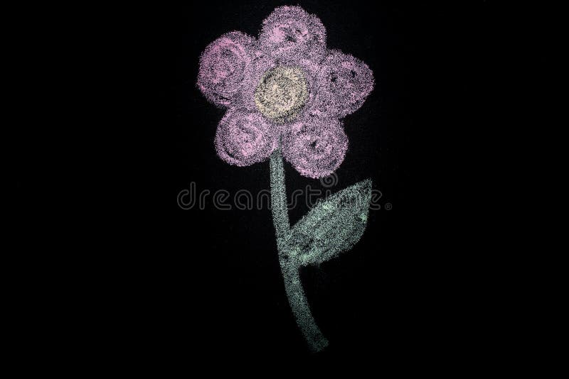 Hand drawn simple flower with white chalk on blackboard