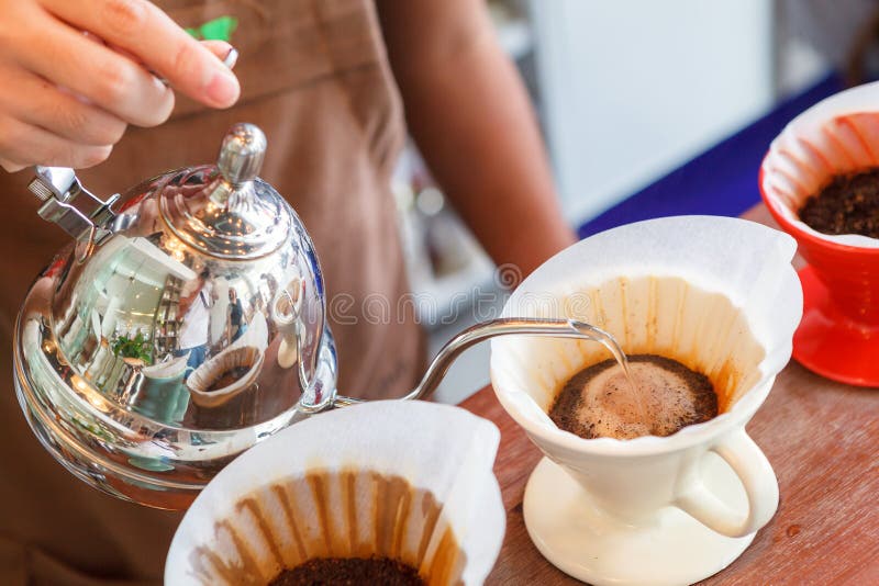 Hand Drip Coffee, Barista Pouring Water on Coffee Ground with Filter