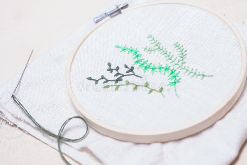 Some hand embroidered green plants