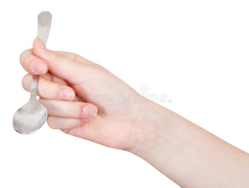 Hand with empty teaspoon isolated