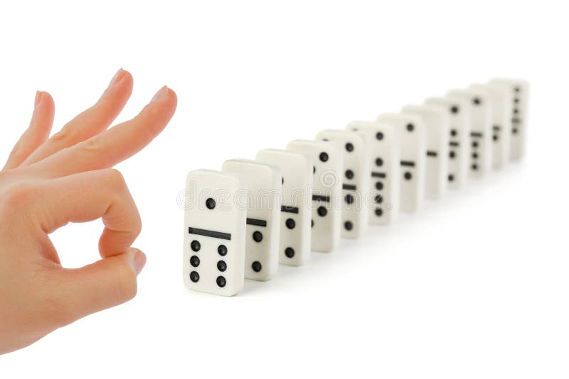 Hand and domino isolated on white background. Hand and domino isolated on white background