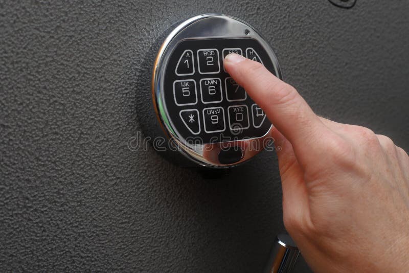 Hand opening digital lock on safe royalty free stock photos