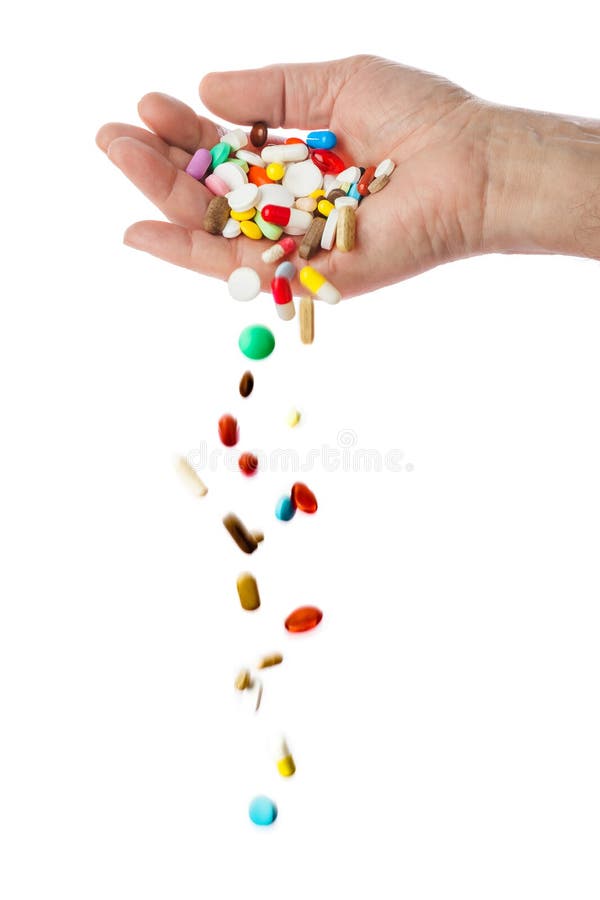 Hand and falling pills