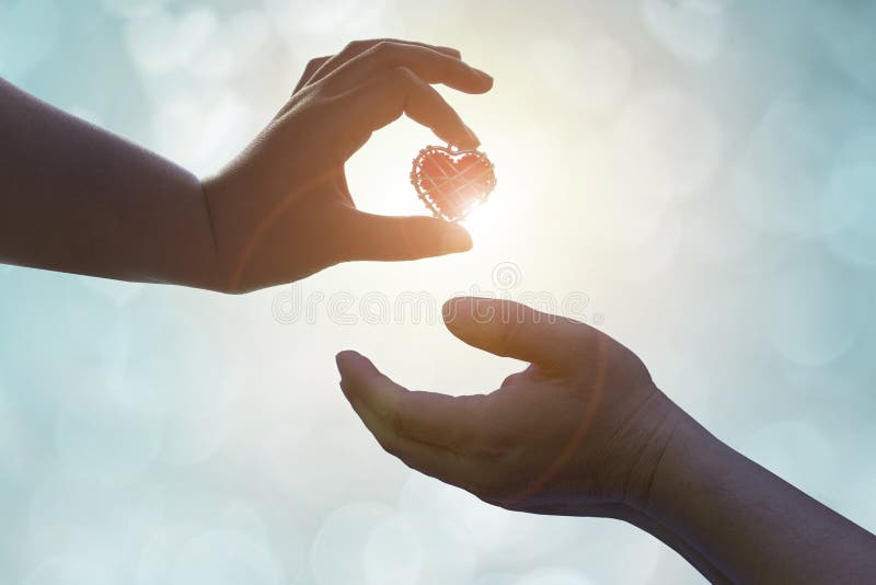Hand is filing love lover or give Valentines gift under warm li royalty free stock images Hand is filing love lover or give Valentines gift under warm li royalty free stock images