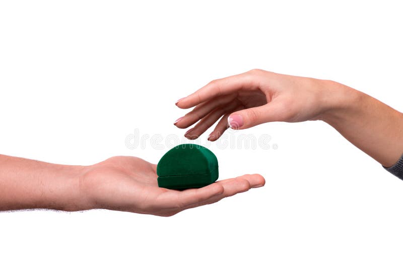 Hand giving box with a wedding ring