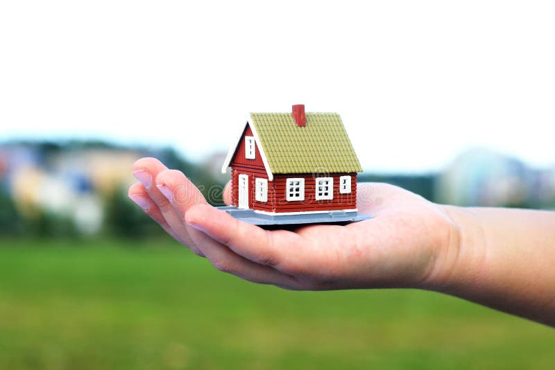 Hand is giving a house stock photo. Image of investment 97843686