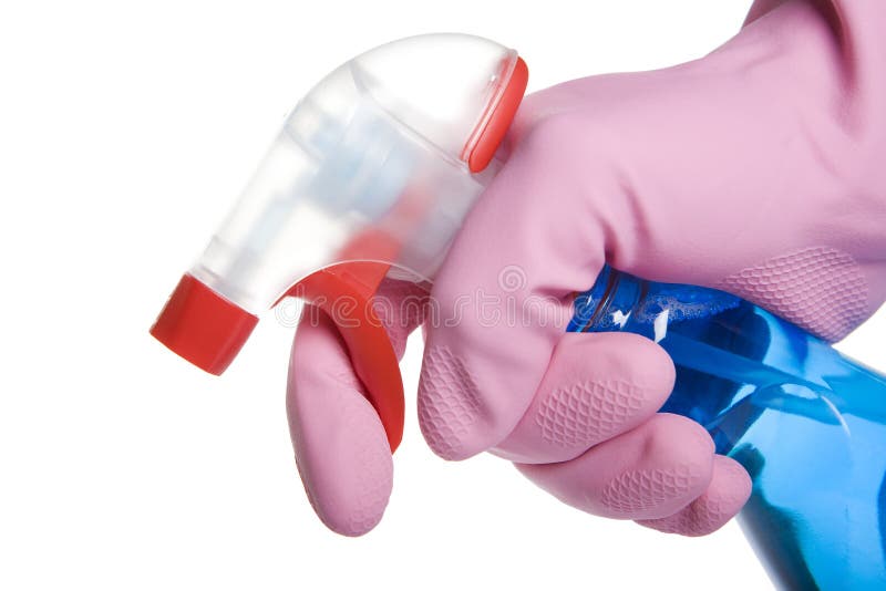 Hand in glove holding a spray bottle of cleaner
