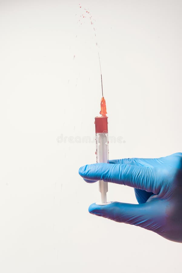 Hand in glove with syringe on white background. Antibodies, illness.