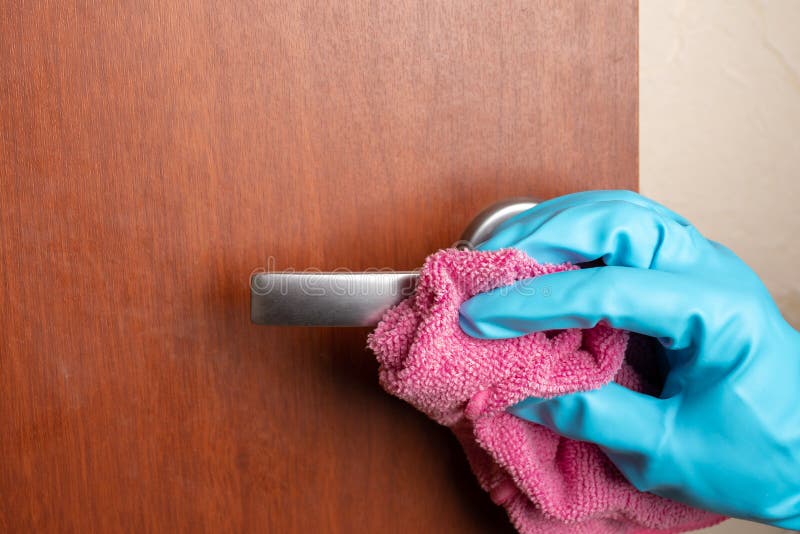 Hand in Glove Wipes Dust from the Door Handle Stock Image Image of