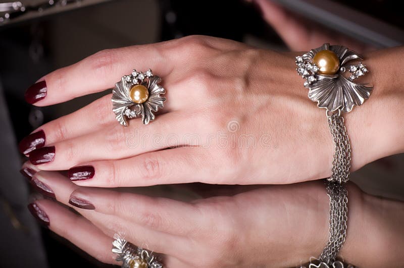 Hand with golden jewelry stock image. Image of brilliant 31524013