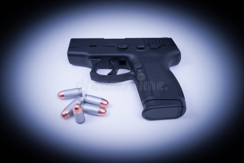 Hand Gun - Spotlighted 45 Auto and Bullets
