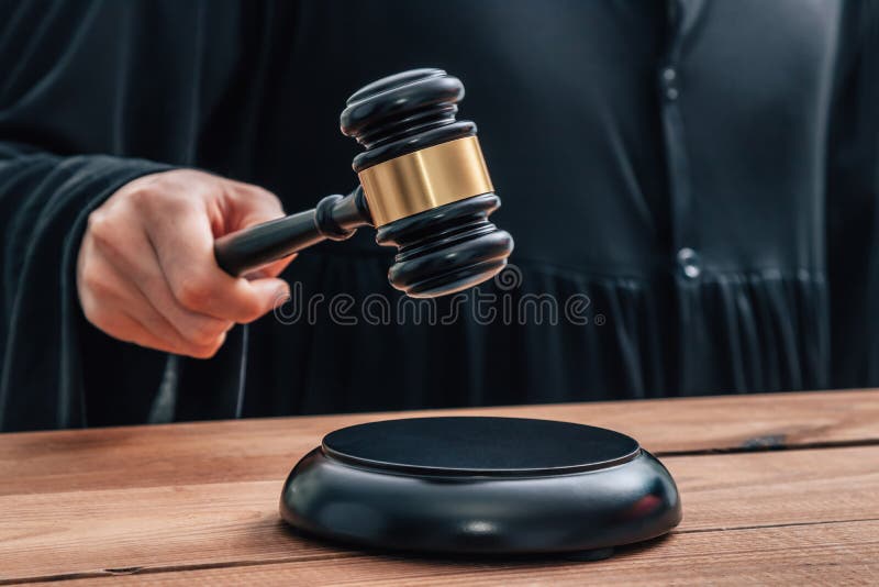 Hand with hammer hitting stock image. Image of attorney 246679189