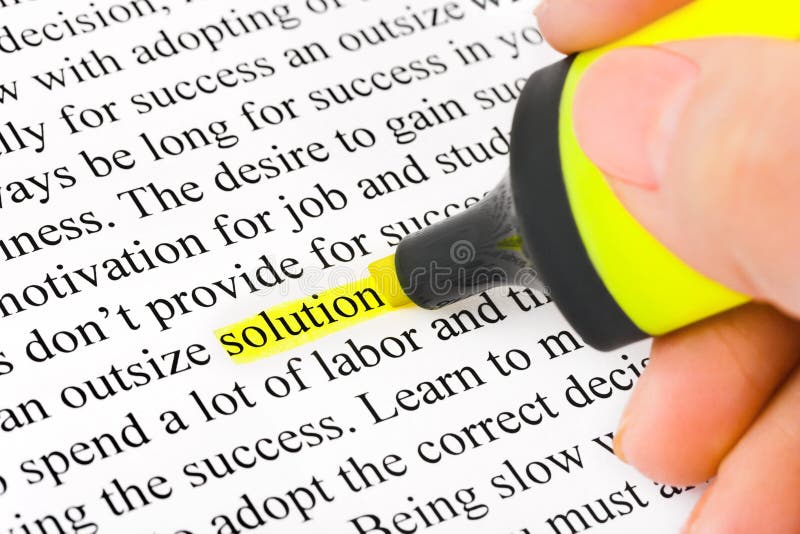 Hand with highlighter and word solution royalty free stock photo