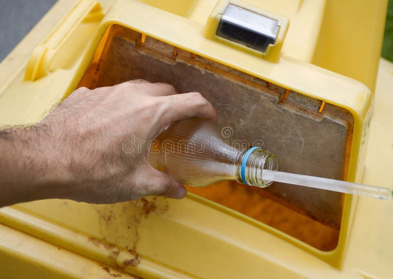 Hand Hold Glass Bottle on Yellow Bin Stock Photo Image of hand, hold