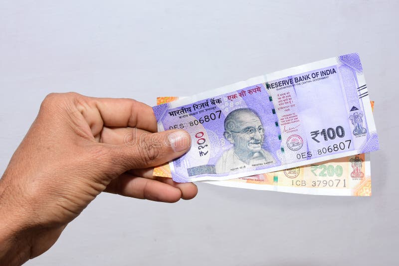 Hand Hold Indian Currencies 100 And 200 Rupees Notes White Background cash-500-rupee-bank-notes-bundles-stock-image-image-of-money