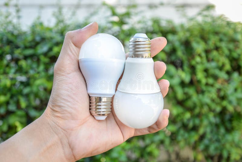 Hand hold two of LED Bulbs royalty free stock photos