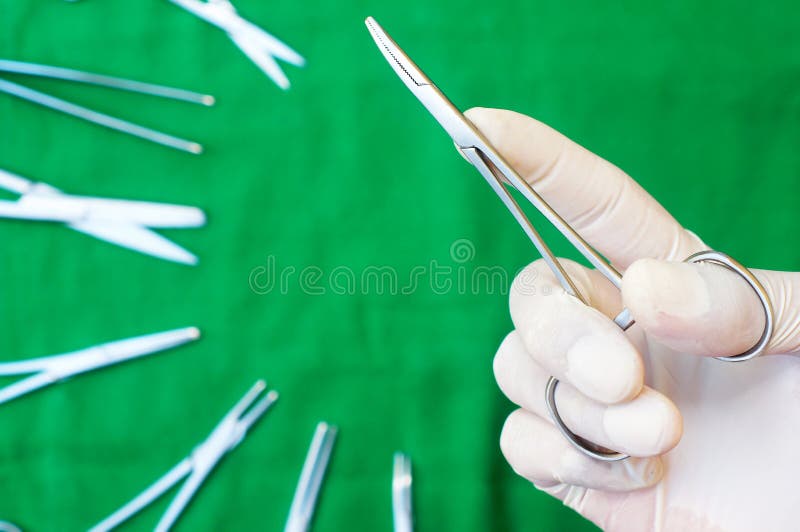 Hand Holding a Bent Surgical Clamps Stock Image Image of holding